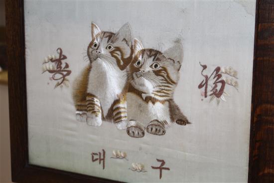 An early 20th century Japanese silkwork panel of two kittens, mounted as an oak firescreen, panel 40 x 43cm and